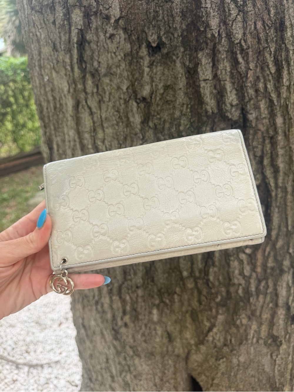 Authentic Gucci Cream GG Embossed Zip Wallet with Charm